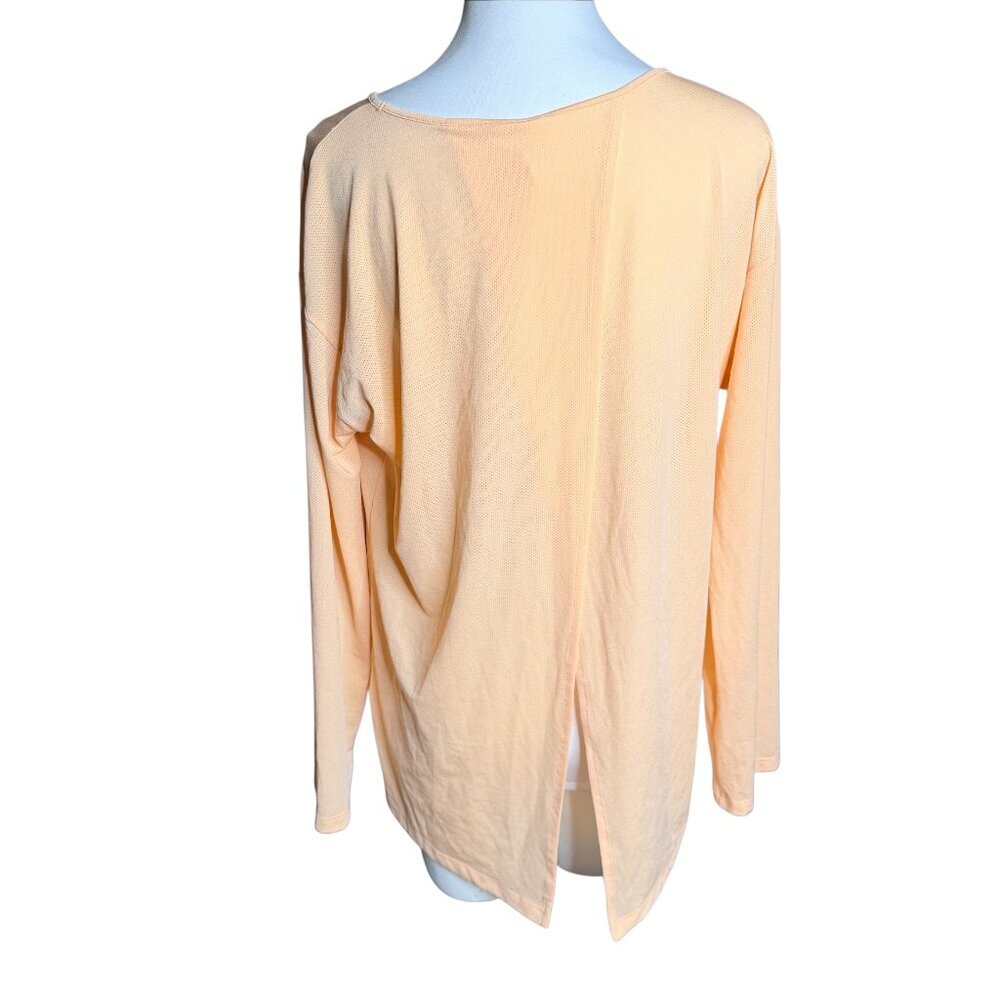 Lucy peach flap open back long sleeve running top lightweight Medium